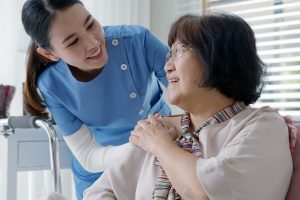 two female touching shoulders
