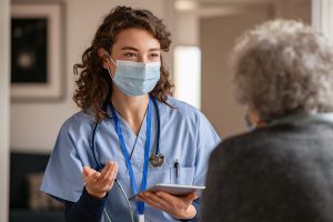 woman in blue cloth wearing a mask
